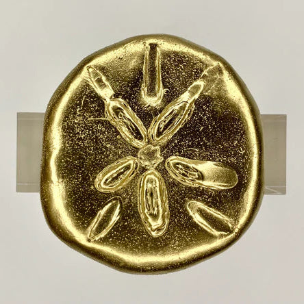 A gold-colored acrylic napkin ring with a starfish design.