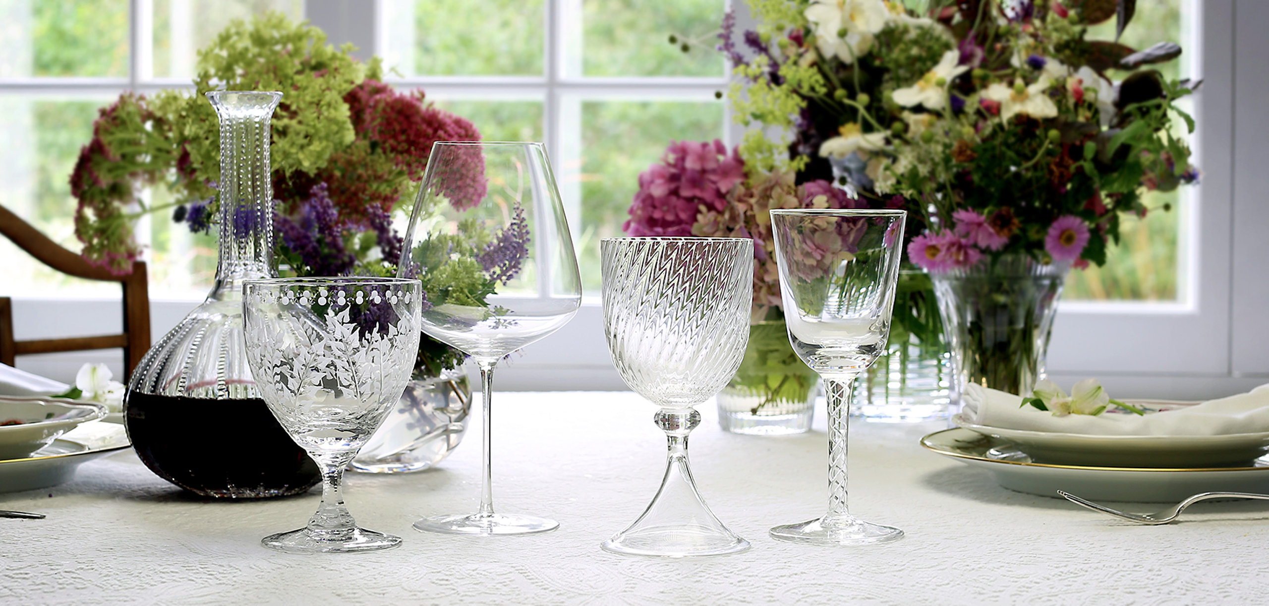 crystal displayed on table with flowers